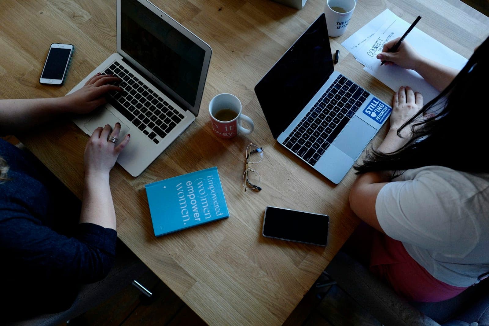A team working in a shared CRM on laptops