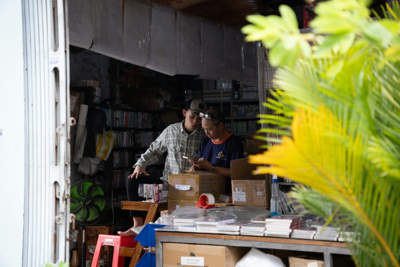 An online retail team reviewing orders on a laptop