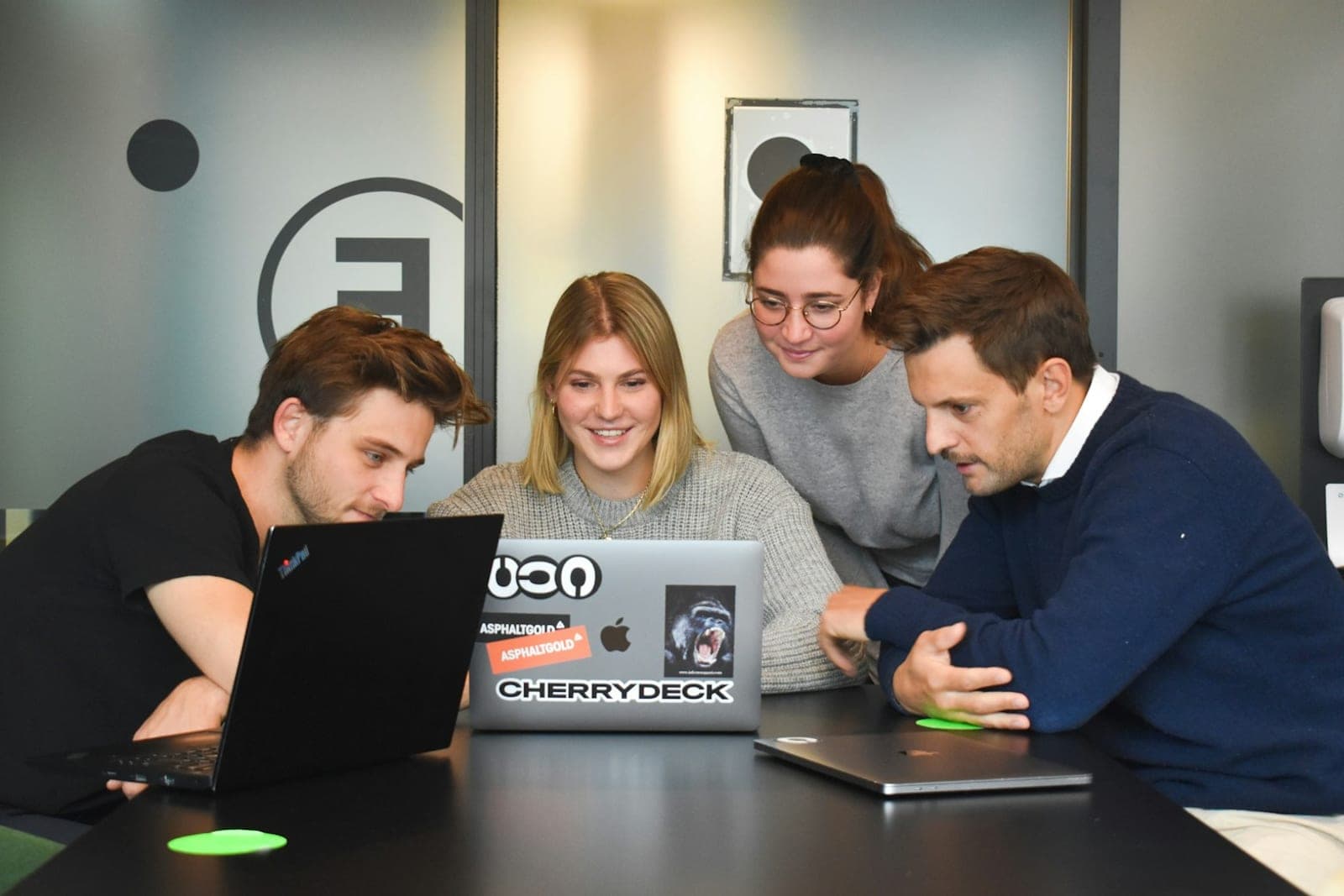 An agency team reviewing client work together