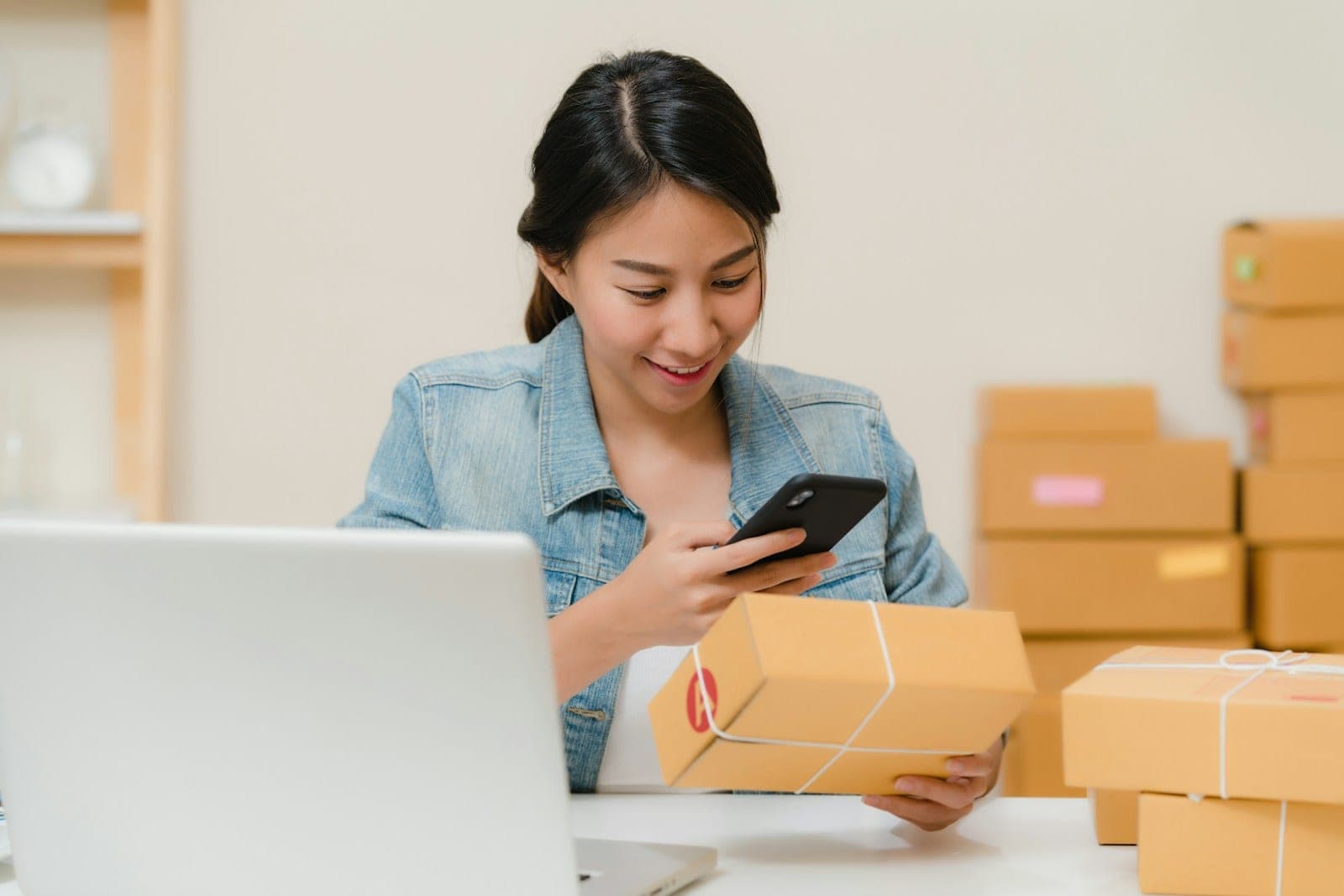 An e-commerce team packing orders in a small warehouse