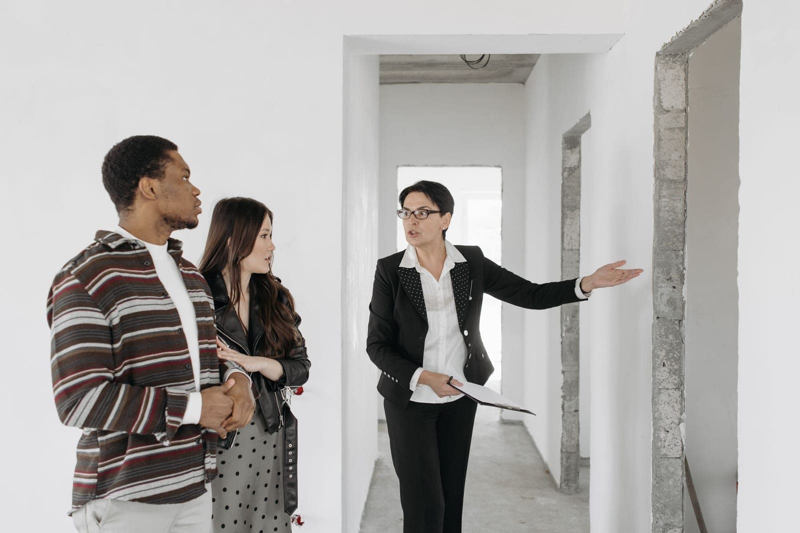 A real estate agent showing a property to a client