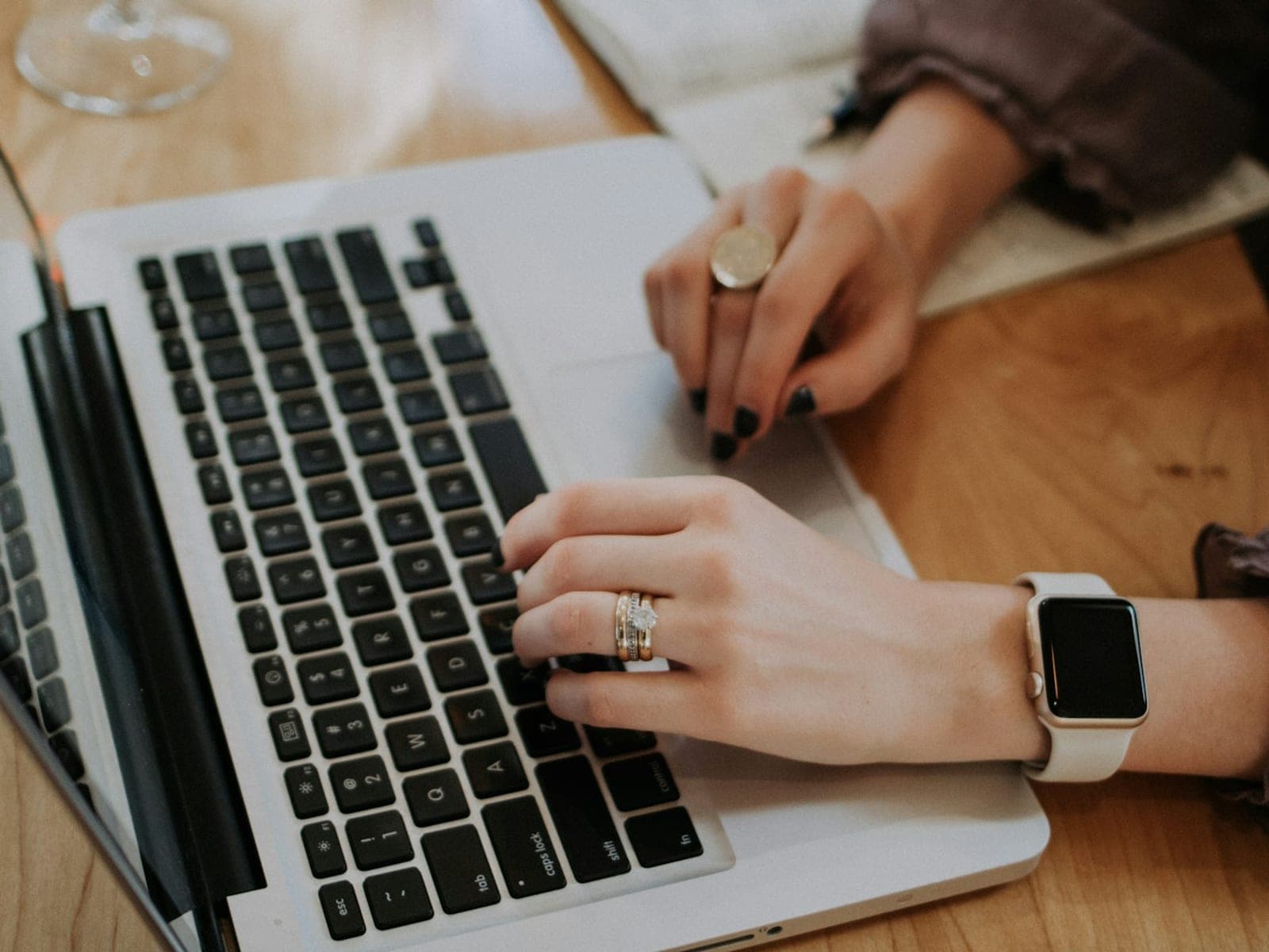 A writer working on an article at a laptop