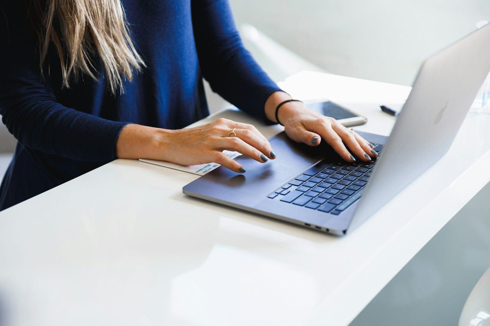A content writer editing an article on a laptop