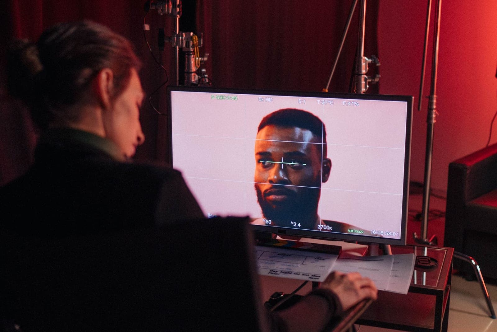 A video editor working on a product video at a dual-monitor workstation